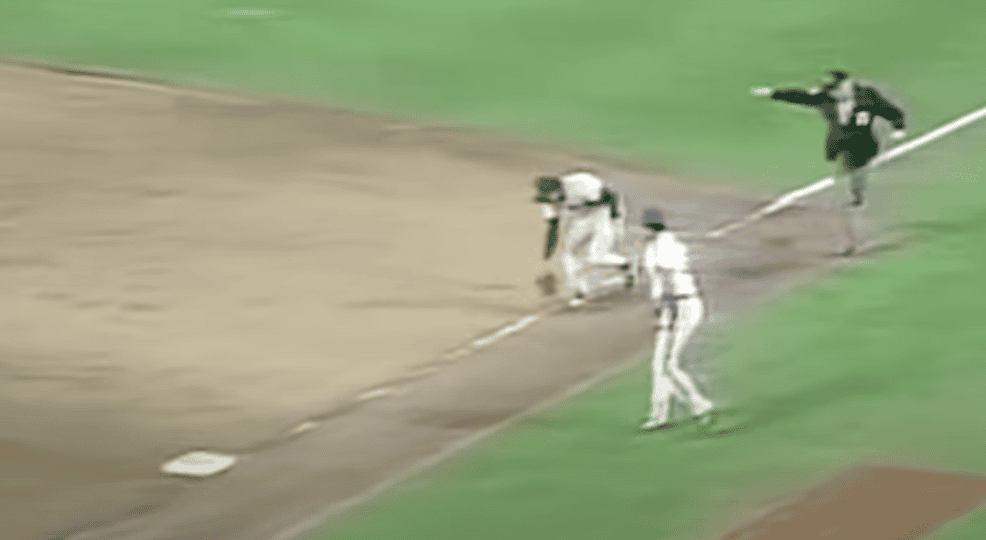 This image captures Bill Buckner's infamous error during the 1986 World Series, illustrating a heartbreaking moment for fans.